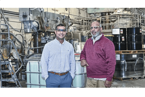 Neil and Raj Goshal standing in Polyset facility